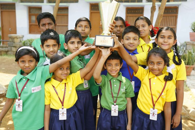 Kabaddi winners with their trophy