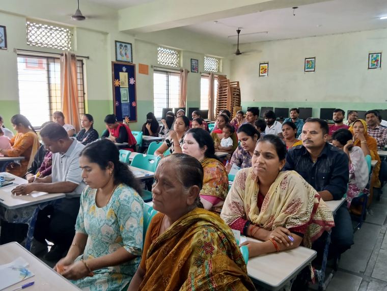 Parents at an orientation session in a classroom